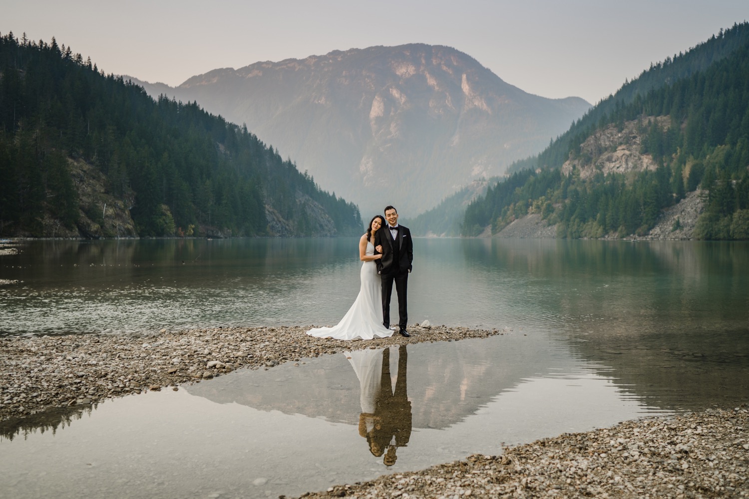 Bride and groom posing at Rattlesnake Lake for their PNW elopement